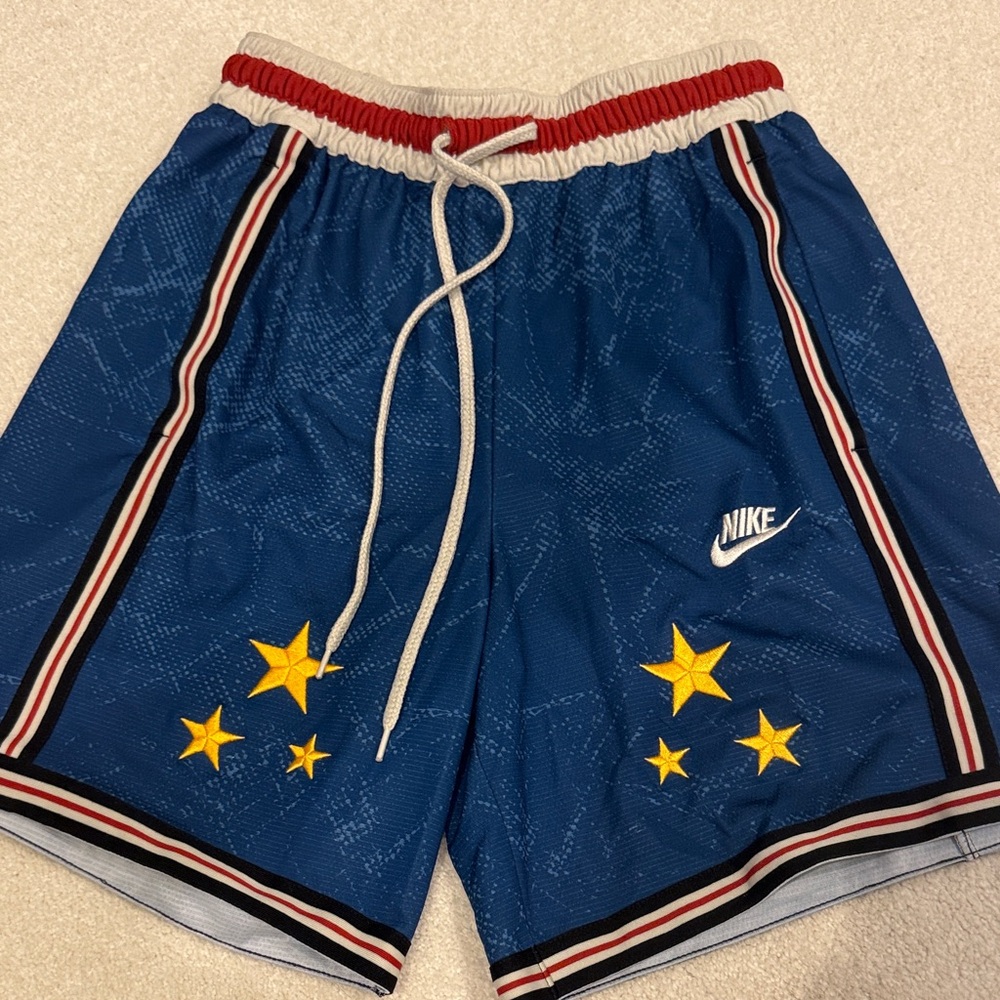 Nike Blue Athletic Shorts with Red and White Stripe
